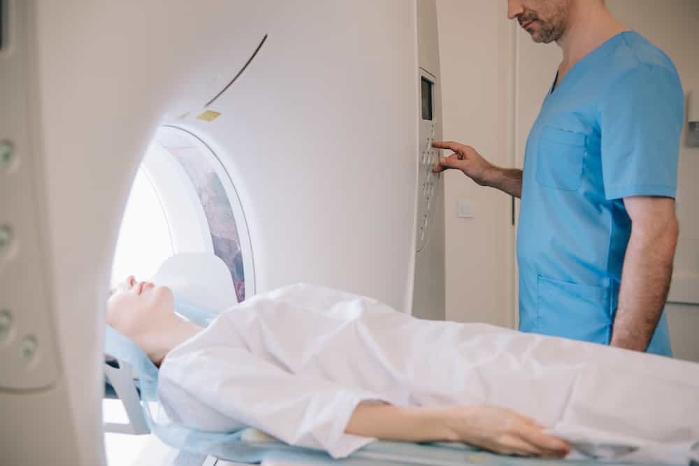 partial view of radiologist operating mri machine 2021 08 30 02 05 59 utc